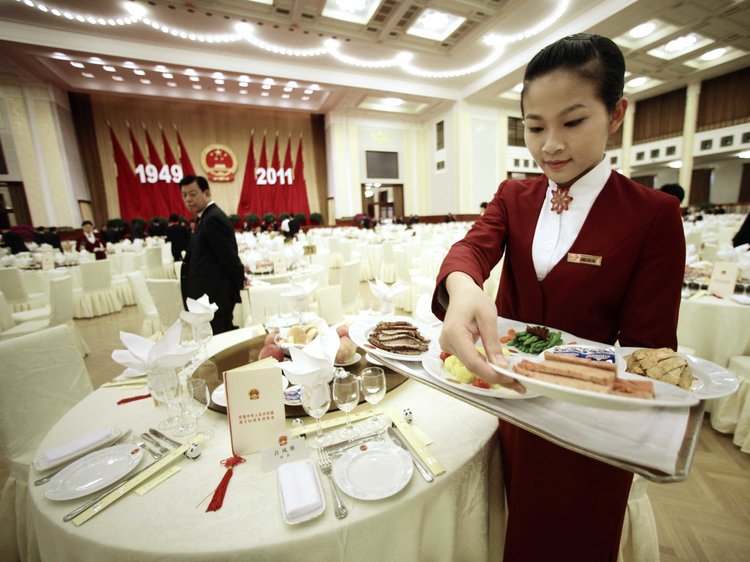 Chinese Communist Party function. Staff preparing dining tables.