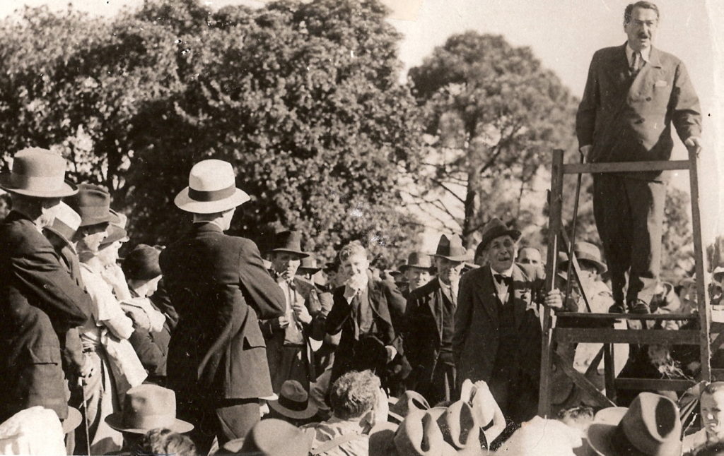 This photograph of Egon Kisch, a Czech journalist, was taken in 1935, four years before Hitler invaded Poland to begin World War II. Many Australians thought highly of Adolf Hitler up until then because he had transformed Germany’s economy. Egon Kisch thought otherwise, and stood on his soapbox at the Domain to warn us all.