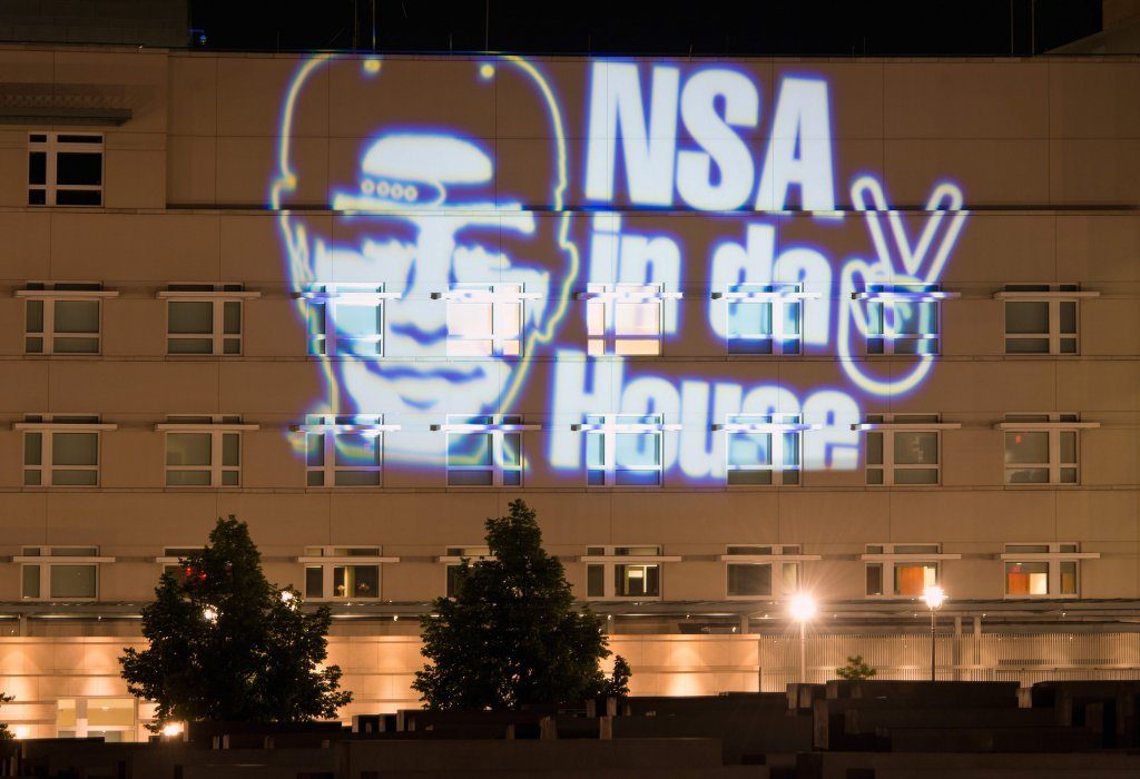 Guerrilla projection on the US embassy in Germany just after it was revealed the NSA was also spying on Germans including Chancellor Angela Merkel's phone.